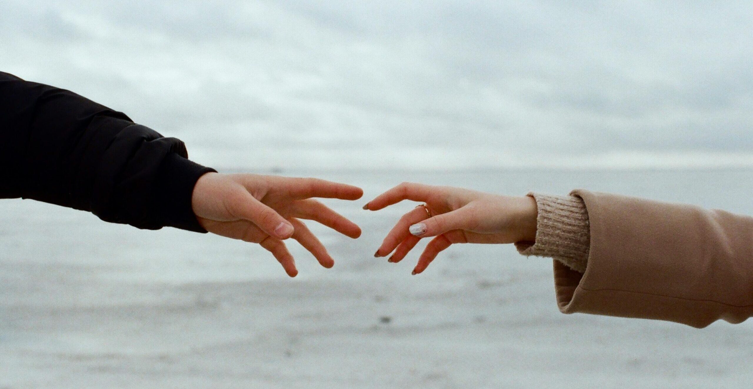 People on the beach parting ways, letting go and outgrowing people